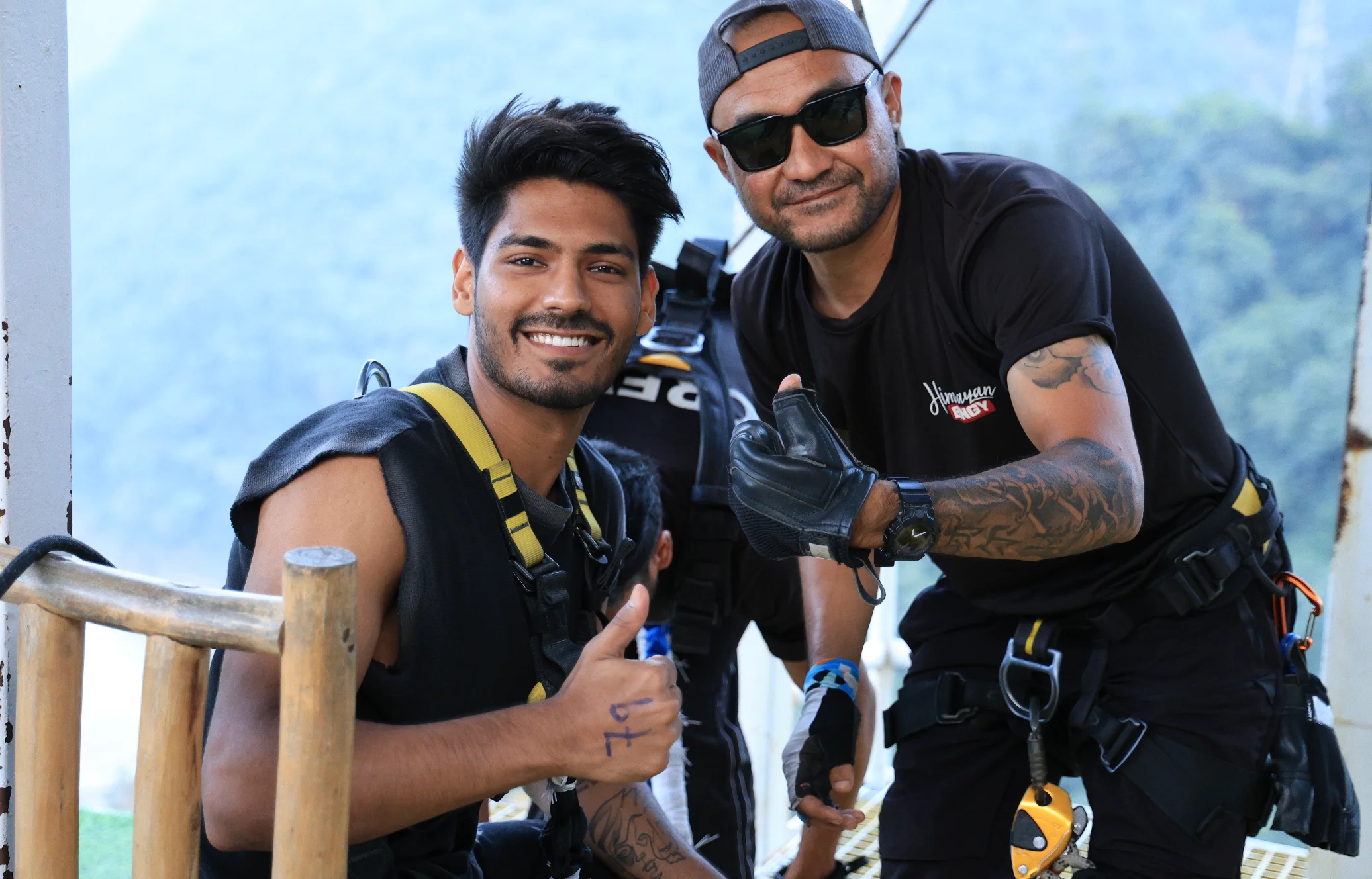 Thrill Seekers Giving Thumbs Up Before the Jump