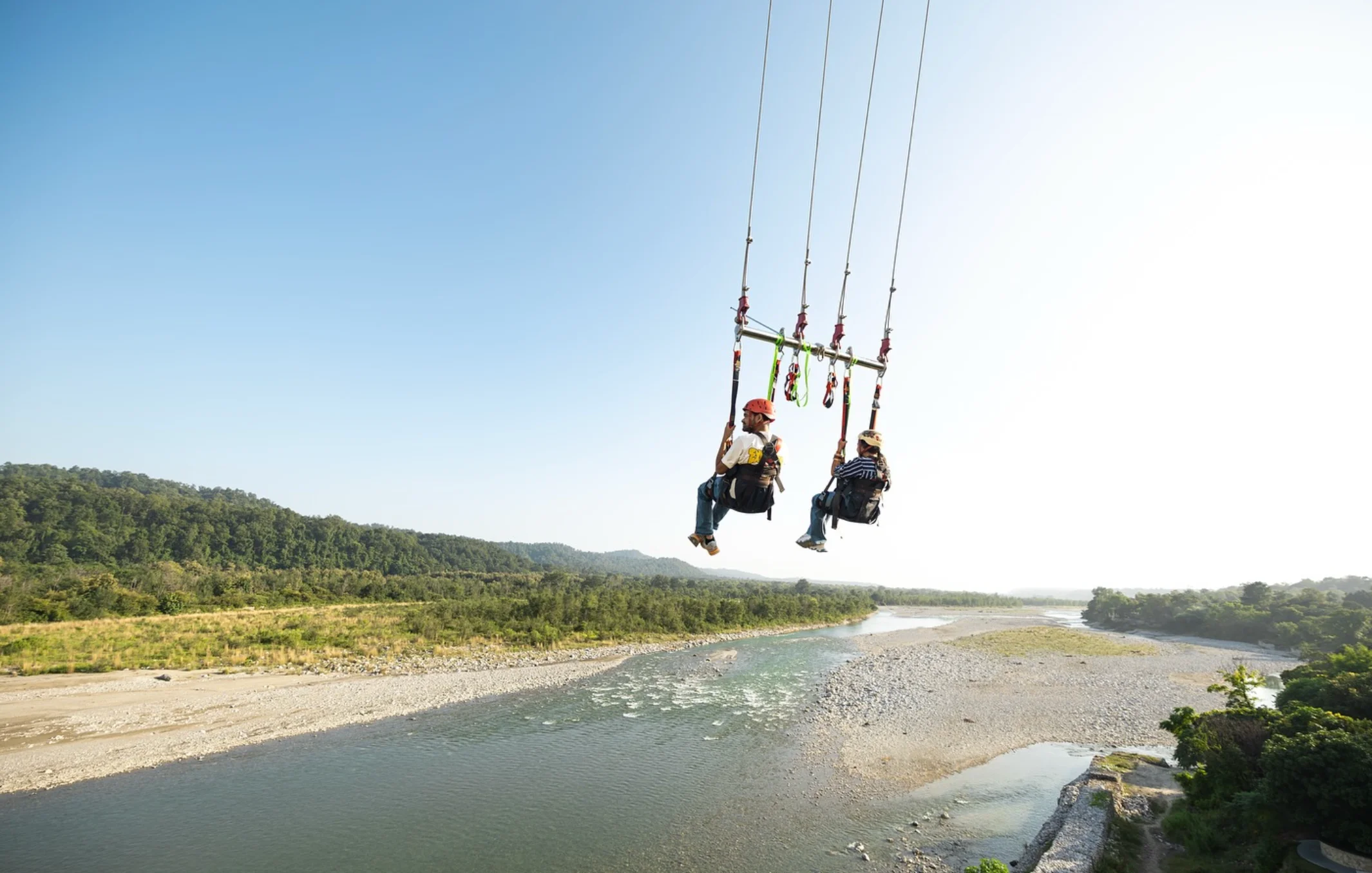 High-Altitude Flight Arc over the River Gorge in Ramnagar