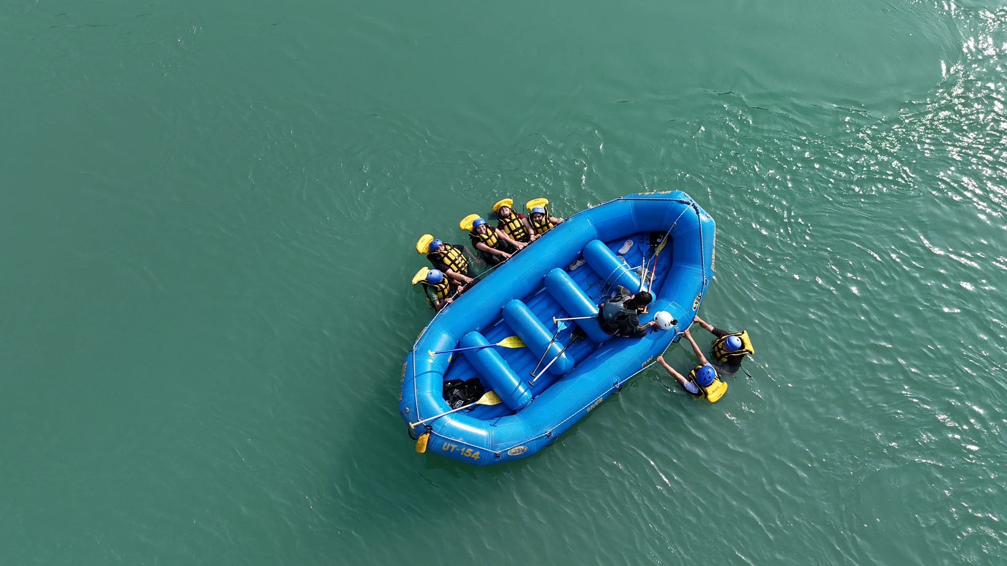Top-Down Overhead Drone View of Raft in Turquoise Waters