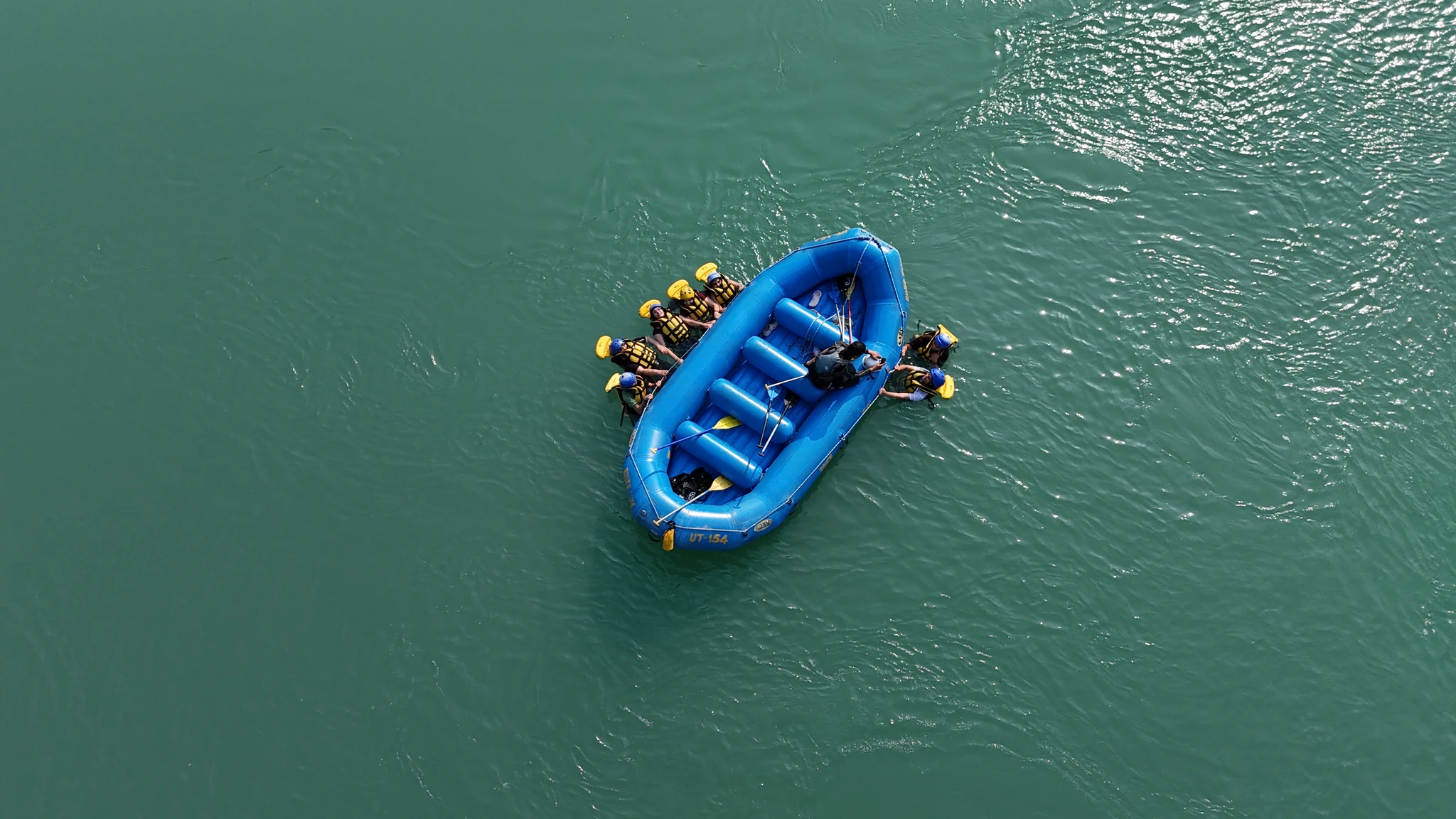 Bird-Eye View of Raft Cruising Along the River Current