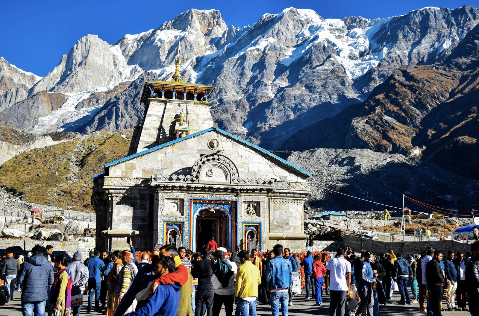 Kedarnath Temple and sacred courtyard flanked by towering snow-capped Himalayan peaks