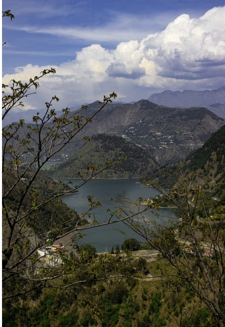 Picturesque hill lake viewpoint surrounded by alpine mountains in Dalhousie