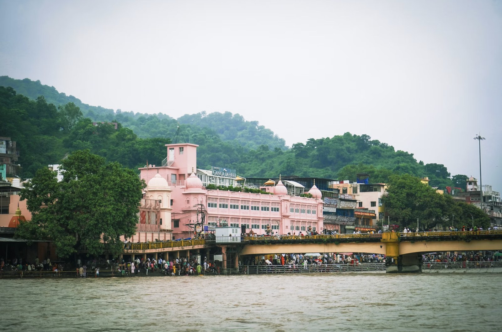 Peaceful riverside ashrams along the holy Ganges against the Shivalik foothills