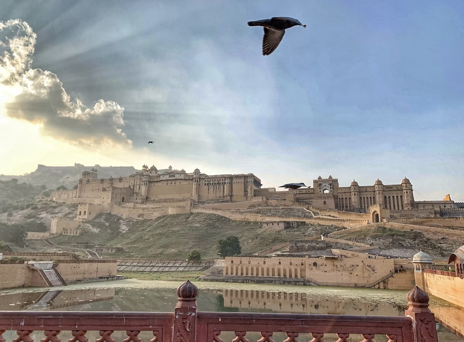Grand sandstone courtyards and ramparts of Amer Fort under open skies