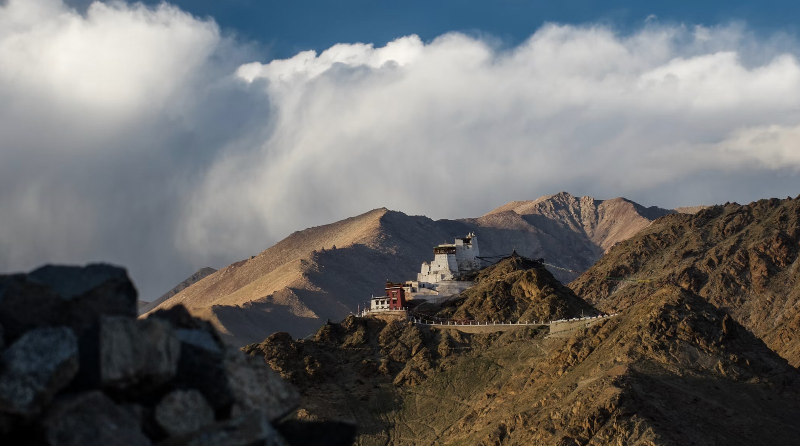 Rugged Himalayan mountain pass with mist-kissed summits in Ladakh