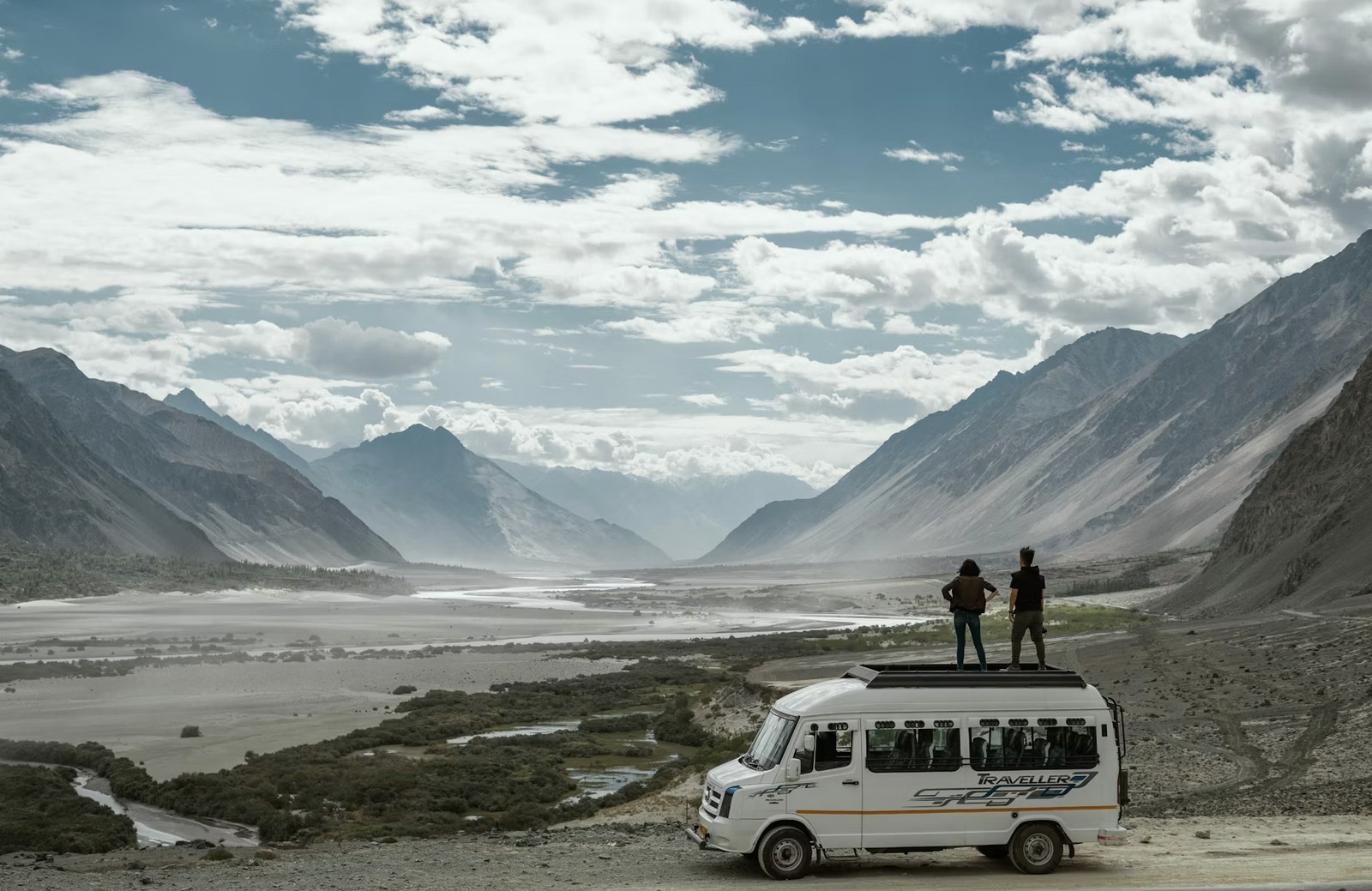 Travelers taking in scenic vistas on the dramatic high-altitude mountain highway