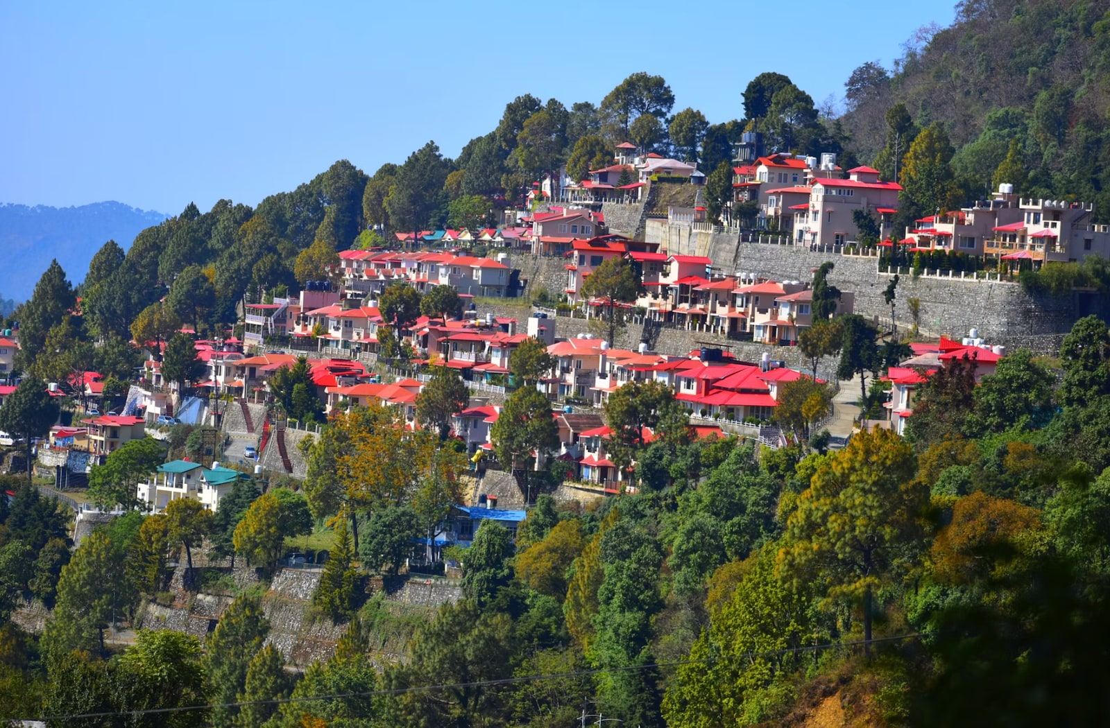 Charming hillside townscape with colonial cottages and terraced slopes