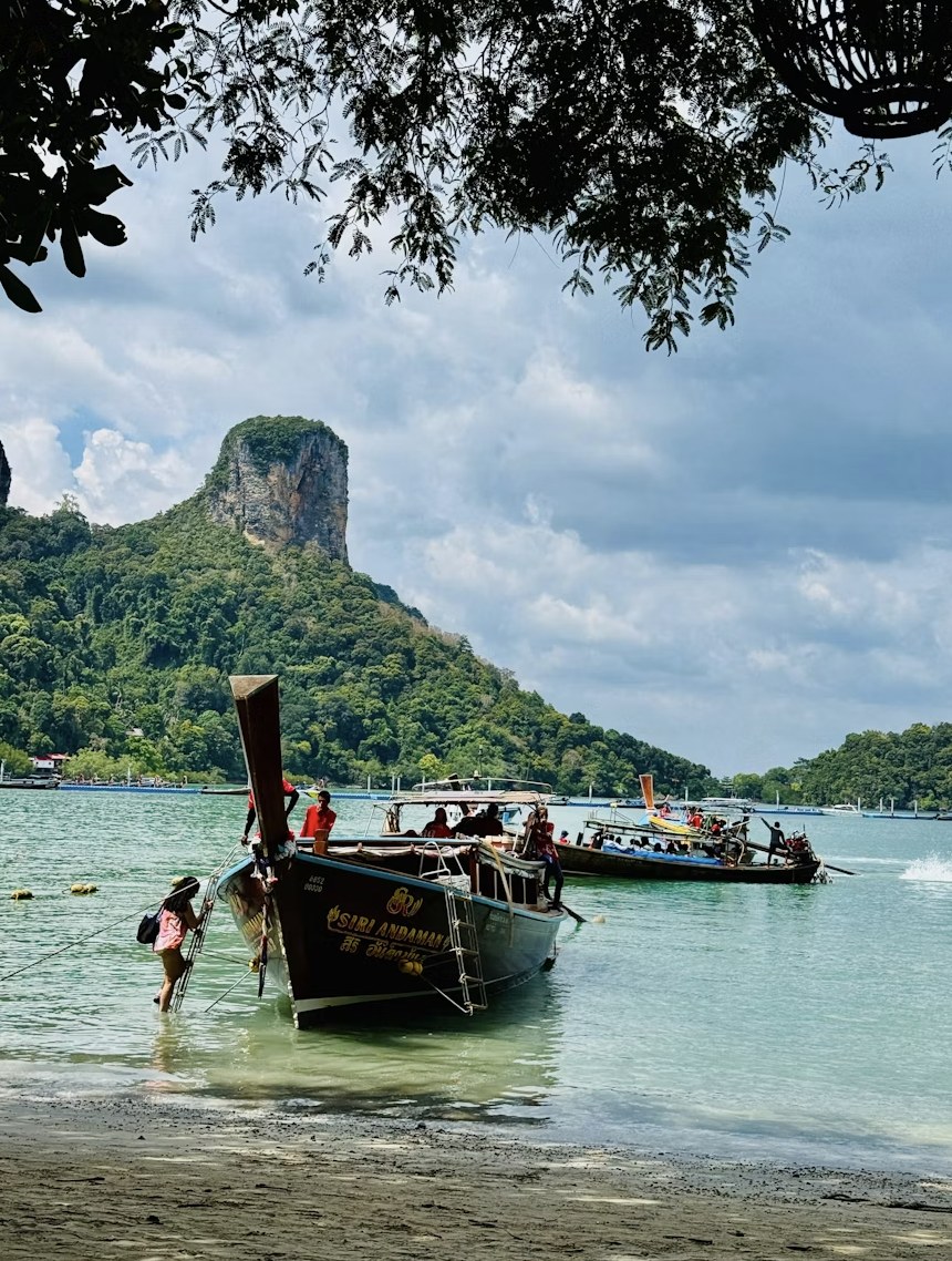 Scenic tropical island coastline with traditional beach boats