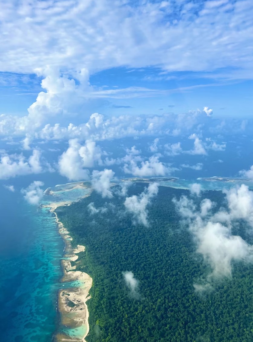 Panoramic aerial perspective of lush tropical Andaman islands and blue ocean