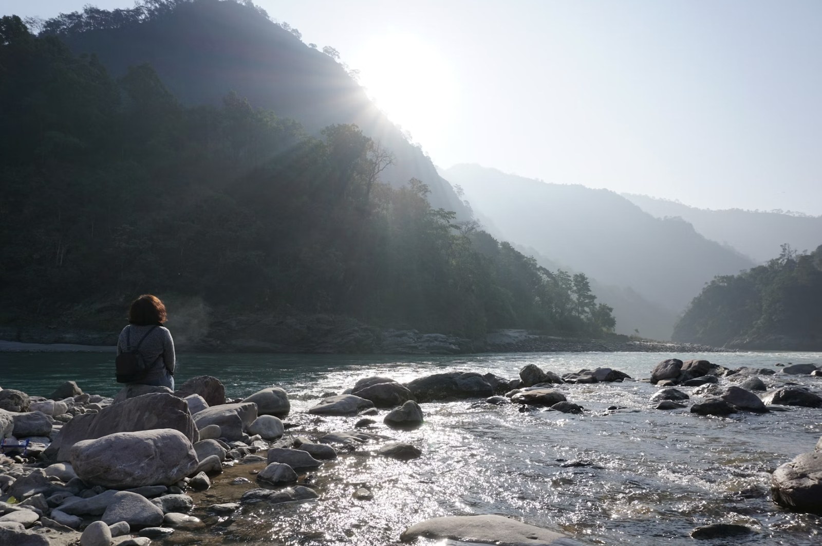 Peaceful morning light glistening over the sacred riverbanks and rocky ghats