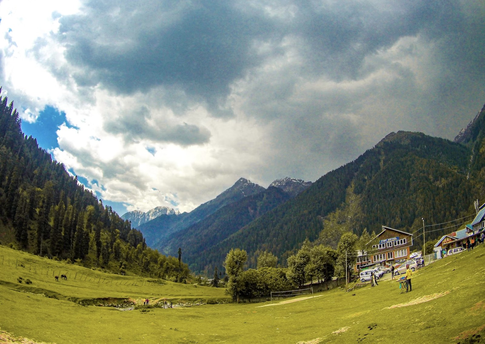 Lush green alpine meadows and dynamic cloudscapes of Kashmir