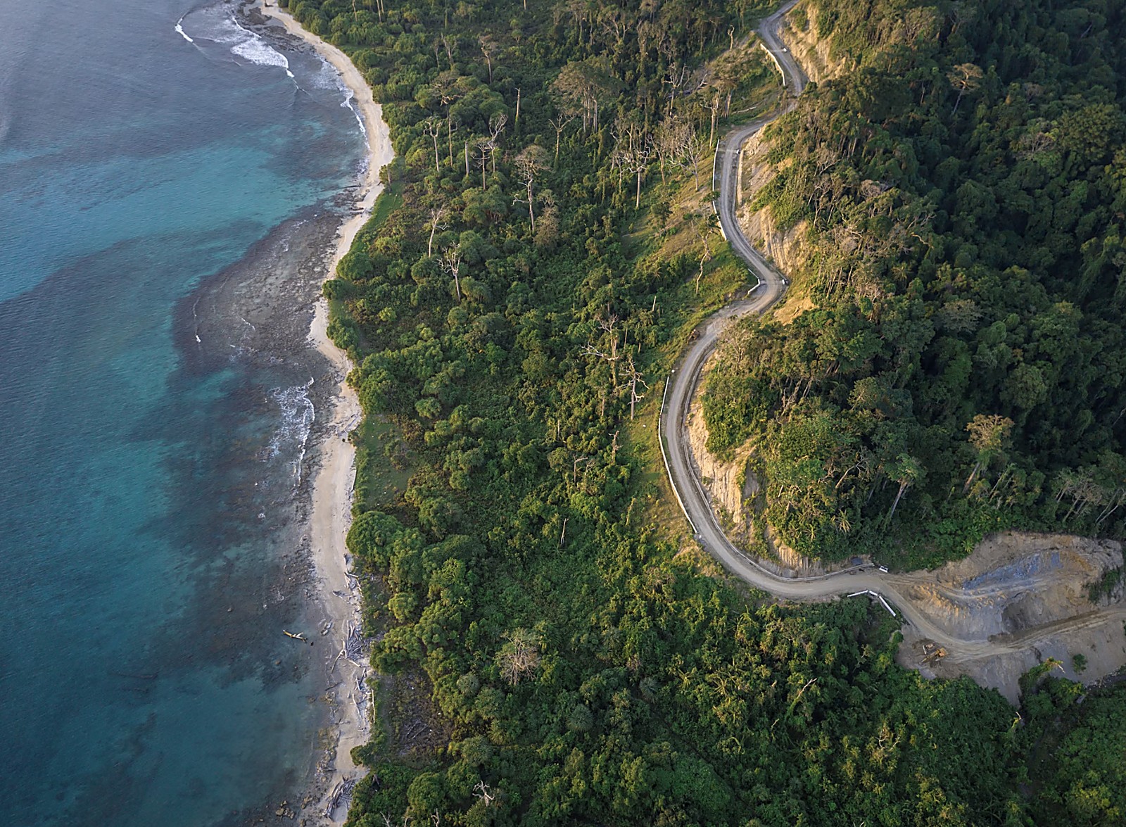 Spectacular aerial coastal reef view with deep blue outer ocean reef drop-offs