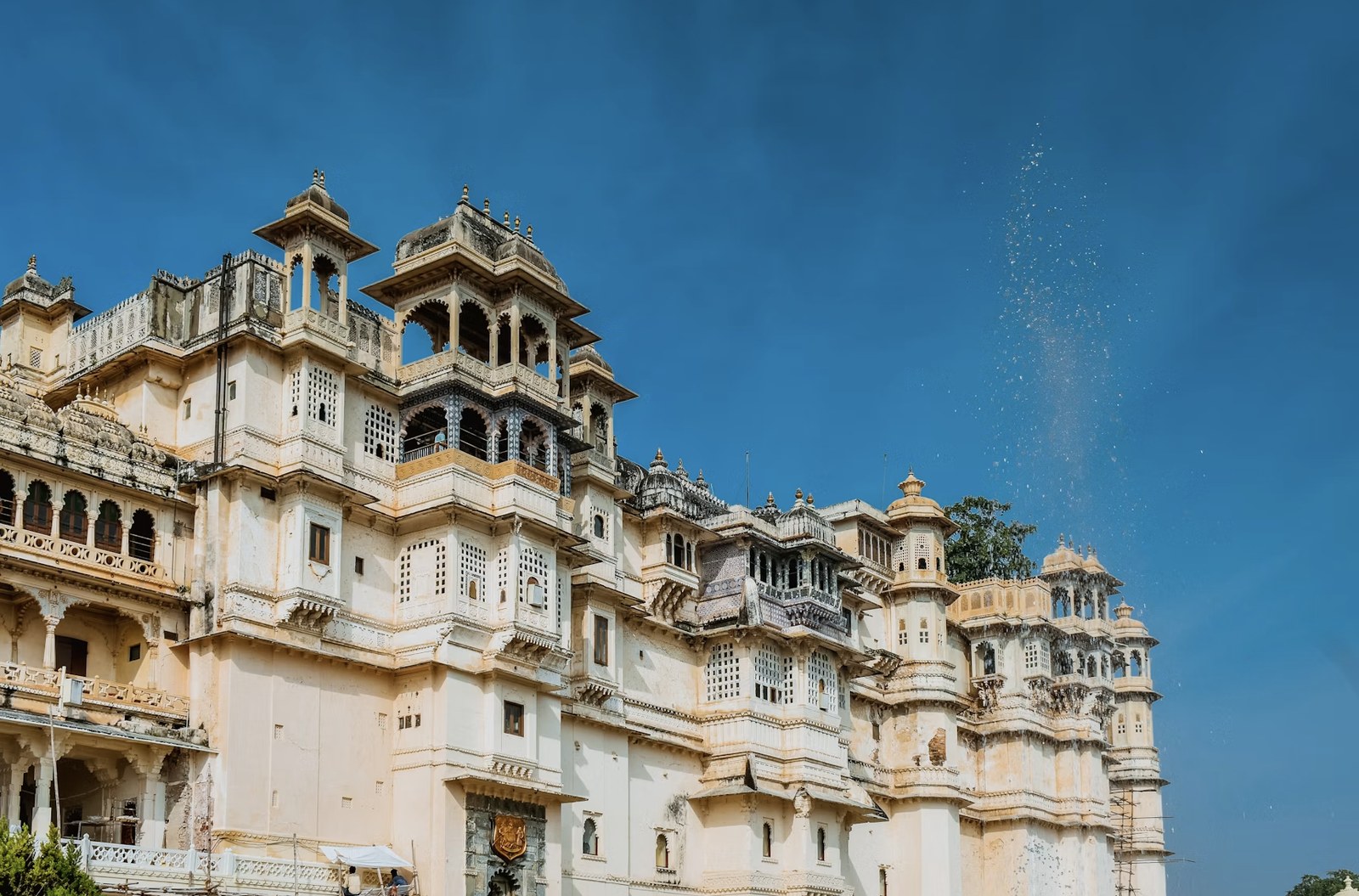 Ornate marble balconies, domes, and jharokhas of Udaipur City Palace