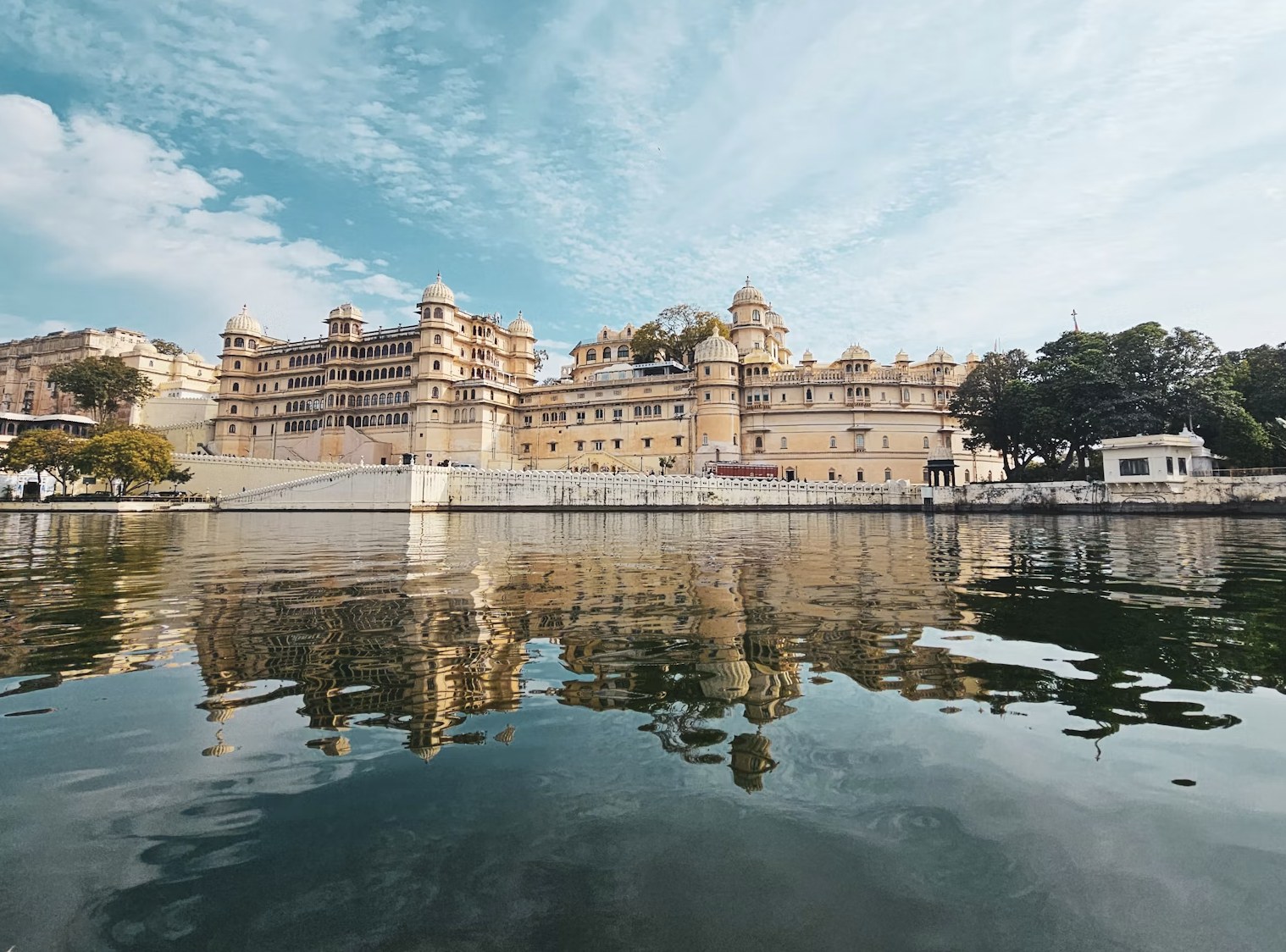 Palatial symmetry and scenic lake reflections across Lake Pichola