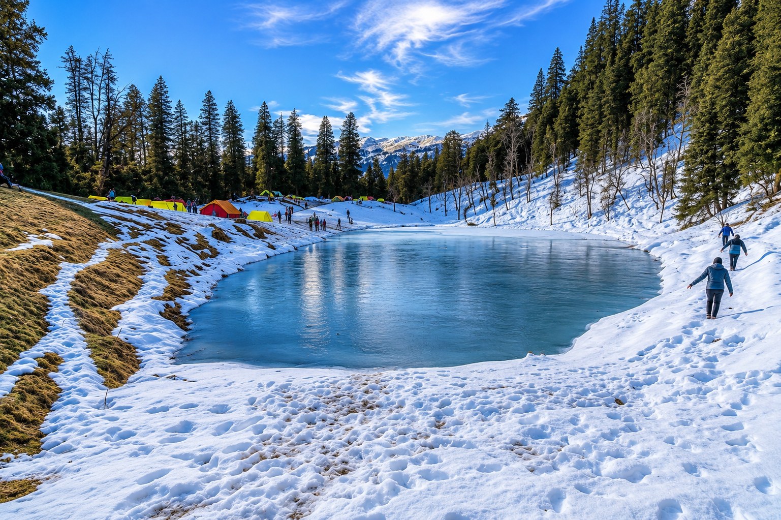 Picturesque frozen Juda Ka Talab alpine lake surrounded by pine forests